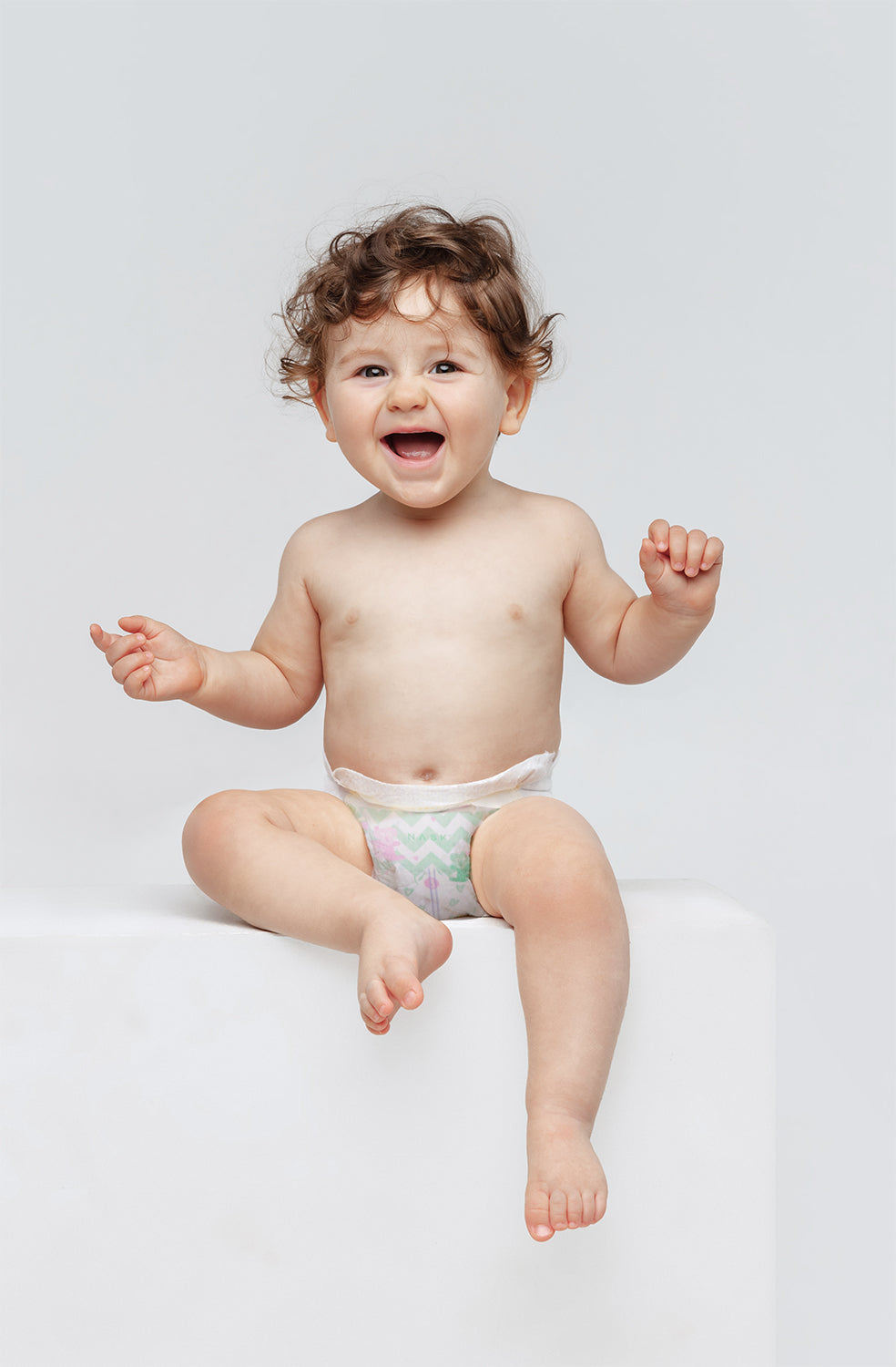 a baby wearing nask baby diaper of S size